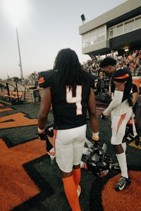 a group of football players standing on a field