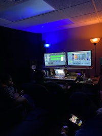 a group of people in a recording studio