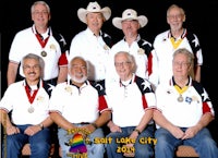 a group of men in cowboy hats posing for a photo