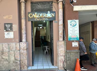 the entrance to a building with a sign for adren cafe