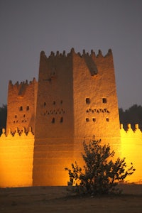 a sand castle lit up at night