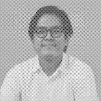 a black and white photo of a man with glasses