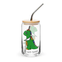 a glass cup with a dinosaur on it and a straw