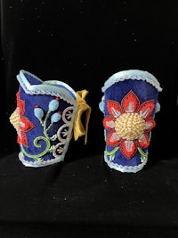 a pair of blue and red flower earrings