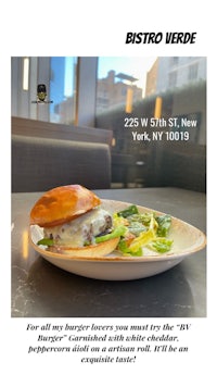 a photo of a burger and salad on a plate