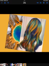 an ipad screen showing a rainbow colored hair with a yellow lake in the background