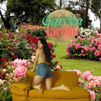 a woman sitting on a yellow couch in a garden
