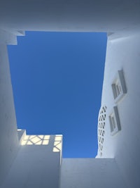 a 3d model of a window in a white building with a blue sky