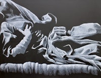 a black and white drawing of a woman laying on a bed