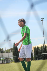 a man is playing soccer on a field