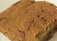 a piece of brownie on a white plate