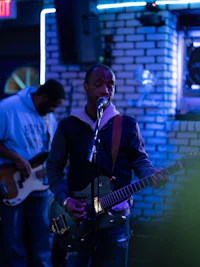 a group of people playing guitar in a bar