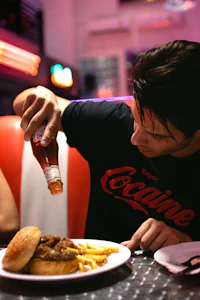 a man wearing a black t-shirt