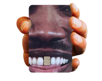 a person holding up a cell phone with a picture of a man's mouth