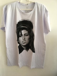 a white t - shirt with a woman's face on it