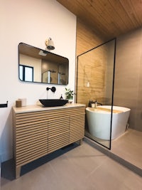 a modern bathroom with a bathtub and sink