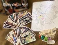 tarot cards, crystals, and other items on a table