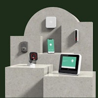 a group of smart devices on a concrete wall