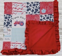 a baby blanket with the words farm girl on it
