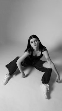 a black and white photo of a woman posing