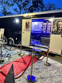 a truck with a red carpet on the ground