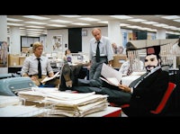 a group of people sitting in an office