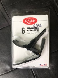 a pair of kser acoustic picks in a package