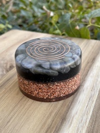 a glass container with a spiral on top of it