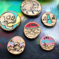a group of wood slices with different designs on them