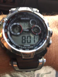 a digital watch on a person's wrist