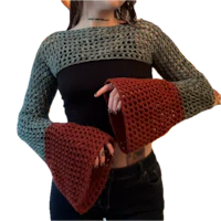 a woman wearing a crocheted bell sleeve top