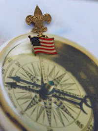 a compass with an american flag on it