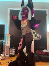 a woman in a mascot costume is standing in a living room