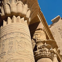 egyptian pillars with carvings on them