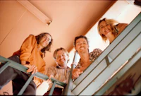 a group of people standing on a balcony