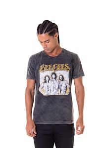 a man wearing a t - shirt with the beatles on it