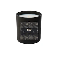 a candle with the word leo on it
