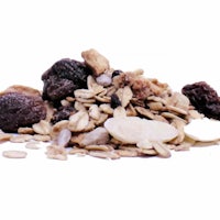 a pile of nuts and raisins on a white background