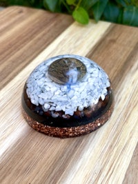 a small glass sphere on top of a wooden table
