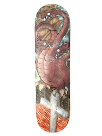 a skateboard with a red dragon on it