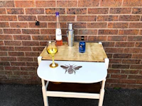 a table with a glass of wine and a bottle of wine