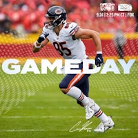 a chicago bears player running on the field