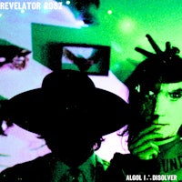 a man and woman in a hat with a green light behind them