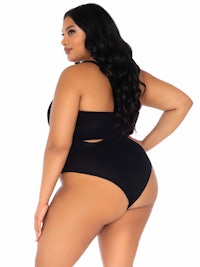 the back view of a woman in a black swimsuit