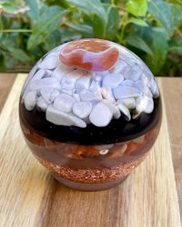 a glass sphere filled with rocks and pebbles