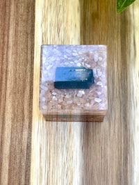 a small box with a stone in it