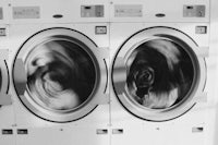 a black and white photo of a laundry room
