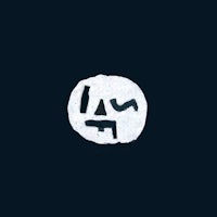 a white circle with a face on it on a dark background