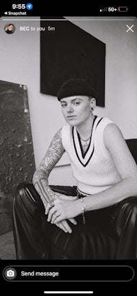 a picture of a woman with tattoos on her arm