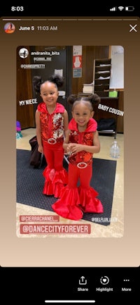 two girls in red outfits standing next to each other
